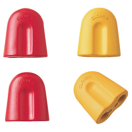 Two red and two yellow  rubber tools  with holes for circular needles to be slotted in.