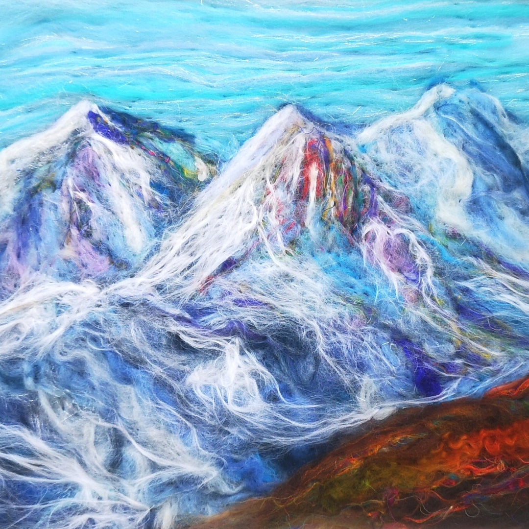 Colorful abstract needlefelting of mountain peaks