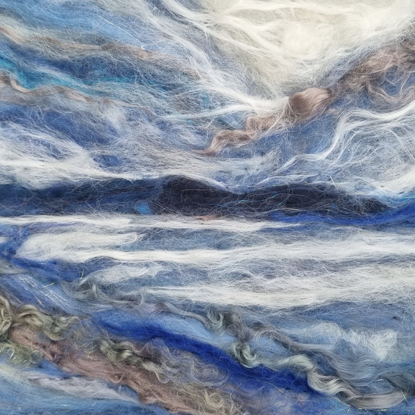 Close-up of blue, white, and brown fibers