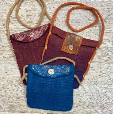 3 large felted bags with straps.