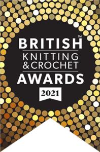 gold and bronze disks surround the words 'british knitting and crochet awards 2021'